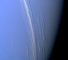 A composite black-and-white photograph showing cirrus clouds over the surface of Mars