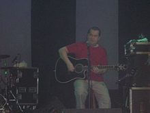 Joe Jewell performing at a festival in Belfast with Aslan