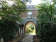 Gothic pointed arch door with bevel profile in the sandstone ground floor (Kortenberg)