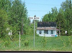 Flat-roofed building and locality sign in Redwater