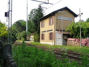 Two-story stuccoed building with hip roof