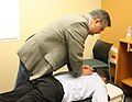 A Chiropractor manipulating the spine.