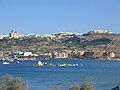 Mellieħa Bay, with the village and its church in the background