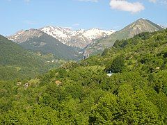 View of Ribnica and Tanuše villages with peaks and mountain pass of Korabska Vrata in background