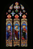 A brightly coloured window at Cassagnes-Bégonhès, Aveyron