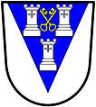 a pile—Argent, on a pile azure three towers, two and one, of the first, in the middle chief point two keys in saltire, wards upwards and inwards, or—Otley Urban District Council, England