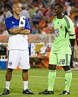 Bill Hamid speaks with Everton F.C. goalkeeper Tim Howard before an international friendly on July 23