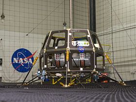 The Modular Common Spacecraft Bus that would become LADEE's bus, being tested at Ames in 2008. Note Apollo 11 astronaut Buzz Aldrin's signature at the top of the bus.