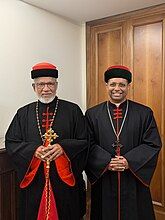 Cardinal Mar George Alencherry (left) and Cardinal Mar George Koovakad (right) in their black and red cassocks representing the tradition of Eastern Syriac Church.