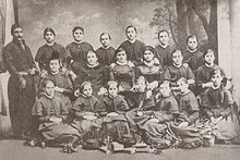 A photograph of Tsarevna Miladinova, the founder of the first Buglarian girls' school in Thessaloniki, with teachers and students at the school.