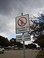 Image 25A sign along Bellaire Boulevard in Southside Place, Texas (Greater Houston) states that using mobile phones while driving is prohibited from 7:30 am to 9:00 am and from 2:00 pm to 4:15 pm. (from Smartphone)