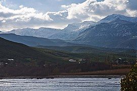 Snow covered Cima di e Follicie (left) from the beach of Pietracorbara