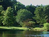 View of west end of the park where a small bridge goes over the Yantacaw Brook before flowing into the pond