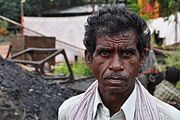 A coal miner in Bachra colliery township in Jharkhand state. In Jharkhand, the the number of years lost per 100,000 population attributable to particulate matter pollution is 1093,[1] adding to the state's public health burden.[1]