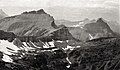 The small Triple Divide Peak (centered) with Norris Mountain on left and Split Mountain to right.