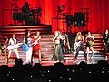 Beyoncé performing "Naughty Girl", flanked with her all-female band Suga Mama and dancers, at the 2007 The Beyoncé Experience world tour