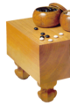 Image 23A traditional Japanese set, with a solid wooden floor board (碁盤 goban), 2 bowls (碁笥 goke) and 361 stones (碁石 goishi) (from Go (game))