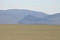 Black Rock Point at Nevada's Black Rock Desert with inferior mirage in foreground on Jun 19, 2004