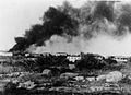 Food warehouse at Ma'ale HaHamisha on fire following shelling from Radar Hill, 1948