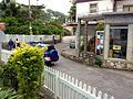 The Road going through Windwardside, past a grocery store