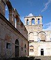 Crumbling stone walls of the Santa Maria de Ovila monastery stand without a roof