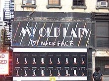 Store front sign that says, My old lady heart symbol loves neck face