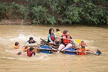 Voortrekker children taking part in a raft race.