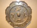 A Tang Dynasty bronze mirror with mythical animals