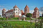 Red brick castle with several towers