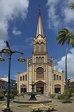 A Romanesque-style cathedral with a single spire