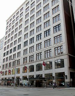 Image of a multistory white terra cotta square building