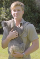 Robert Irwin with a koala