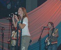 Simmons (left) performing with Addison Road in 2006