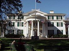 Three-story house with semicircular portico