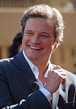 Photo of Colin Firth receiving a star on the Hollywood Walk of Fame in 2011.