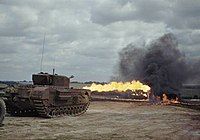 A Churchill tank fitted with a Crocodile flamethrower in action.