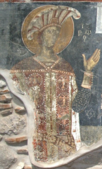 Depiction of Andrea II Muzaka in the church. His coat of arms, awarded by the Byzantine emperor, can be seen on the fresco.