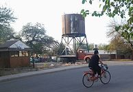 The dilapidated albeit picturesque railroad water tower in the background (beyond the derelict truck) is a heritage asset; it was built up by a British company in the late nineteenth century.