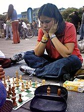 A girl playing chess in Mexico City