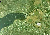 Geilston Bay, Tasmania, aerial photograph 27 Nov 2002. The Lindisfarne Golf Course site is now occupied by buildings of the Geilston Bay High School (constructed 1971-2) and its playing fields cover the area where the former quarry used to be.