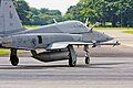 An F-5S Tiger-IIs of 149 Sqn taxiing towards the runway.