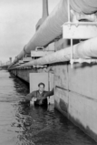 A gauge inspector and the Manville gage house built into Van Veghten's Bridge abutment during the flood of December 31, 1948