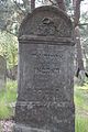 Tzedakah box on Jewish gravestone. Jewish cemetery in Otwock.