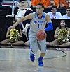 Michael Dixon is dribbling the ball for the Memphis Tigers at the NCAA Tournament in Raleigh