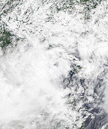 Satellite image of Sinlaku at peak intensity on August 2. The system had an exposed center at the time before moving inland.