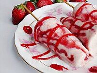 Kulfi from India with strawberry sauce.