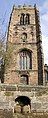 Tower from the west showing the water trough built into the wall, the clock and the louvred bell tower