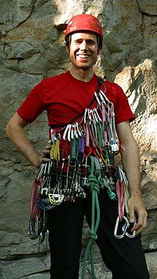 Climber carrying their rock climbing equipment