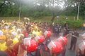 The police form a human line near the National Palace.