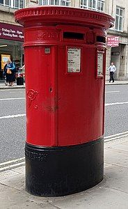 A double aperture pillar box in Fleet Street, London. This pillar box was made between 1899 and 1901, as it bears the Royal cypher 'VR' for Queen Victoria.